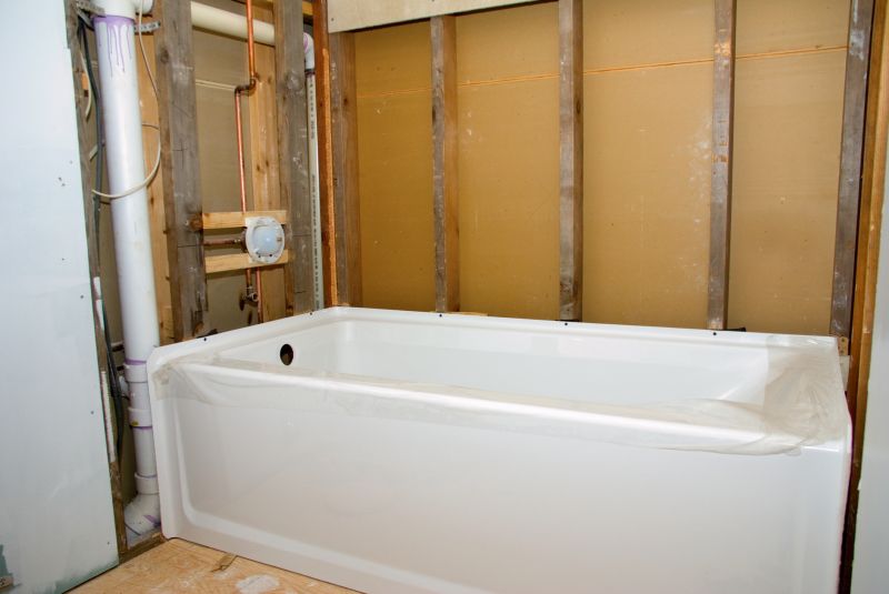 Worker Installing Bathtub